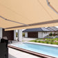 Robust, kvalitativ, grå terrassmarkis med volang, markisen har grå konstruktion med beige markisväv. Monterad på en uteplats med pool. Premium Markis, modell Palladio. premium-markis.se